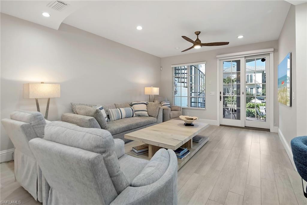 1160 Clam Court, Unit 3 Naples, FL 34102 - Photo 8 of 50 a living room with furniture and large window
