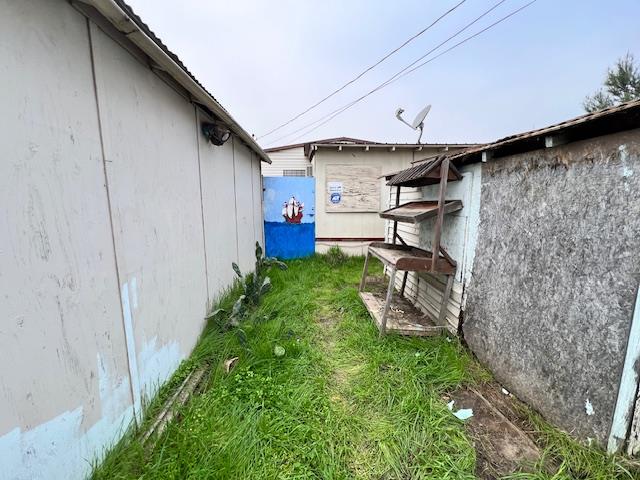 5208 9th Street Keyes, CA 95328 - Photo 26 of 35 a view of a backyard with plants and a patio