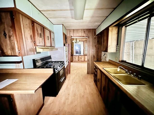 5208 9th Street Keyes, CA 95328 - Photo 6 of 35 a kitchen with stainless steel appliances granite countertop a sink a stove and a refrigerator