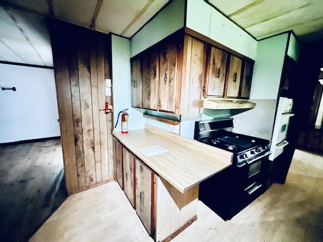 5208 9th Street Keyes, CA 95328 - Photo 7 of 35 a view of kitchen island with furniture and wooden floor