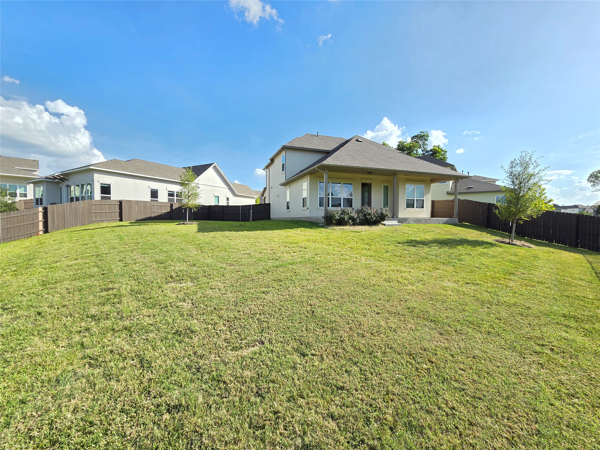 600 C-Bar Ranch Trail, Unit 121 Cedar Park, TX 78613 - Photo 32 of 32 A generous lawn and privacy fencing create a delightful outdoor haven.