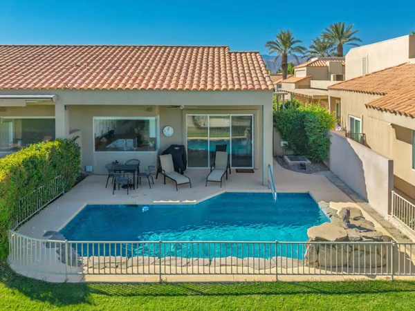 a view of a house with backyard porch and patio
