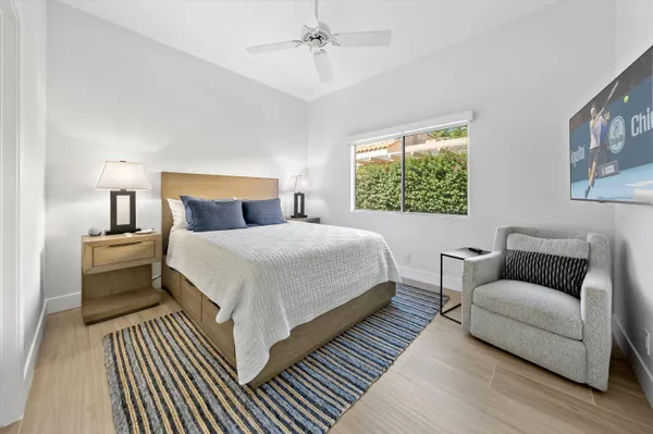 a bedroom with bed and a couch