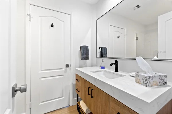 a bathroom with a sink and a mirror