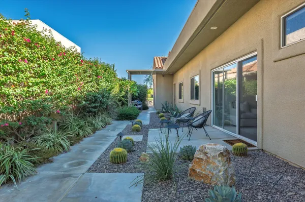 a view of backyard with patio