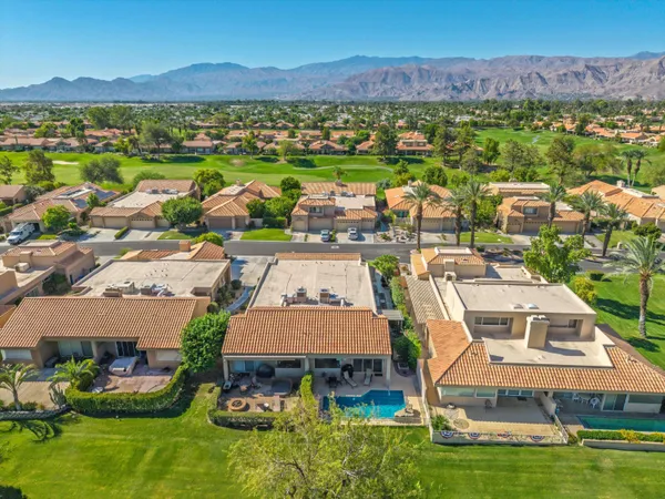 an aerial view of a house with a garden
