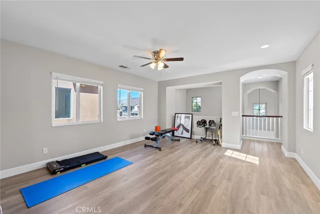 a view of a room with gym equipment and a window