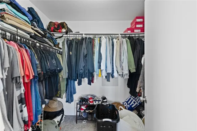 a room with furniture and baby bed