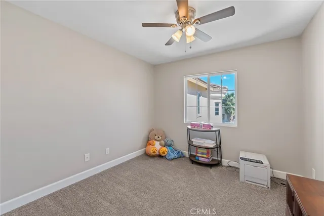 an aerial view of a house with a yard and lake view