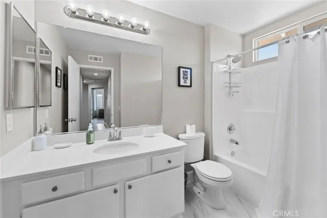 an aerial view of a house with a yard and potted plants