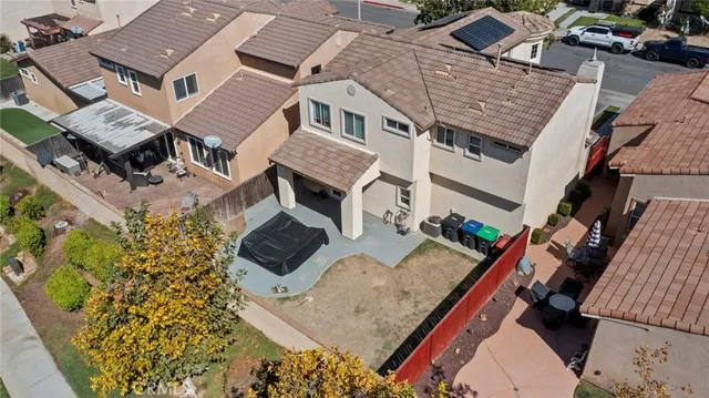 an aerial view of a house with a yard and lake view