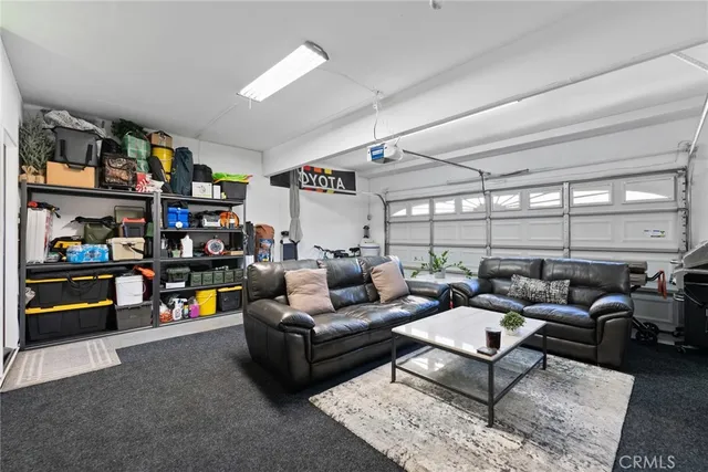 a view of a house with swimming pool and sitting area