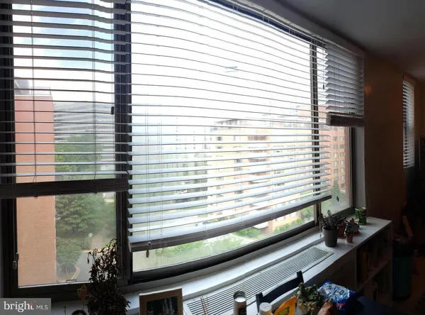 a view of a room with a large window