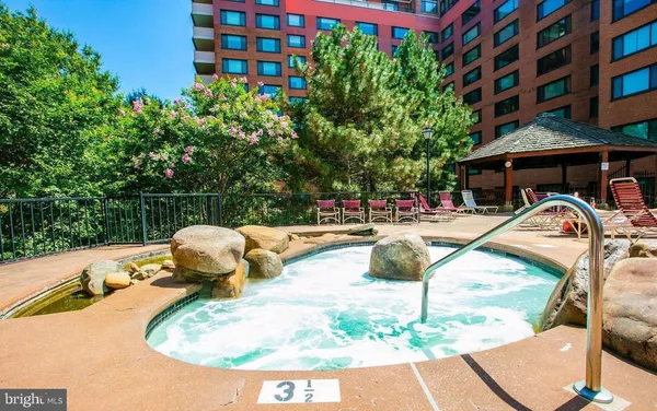 a view of a swimming pool with a patio