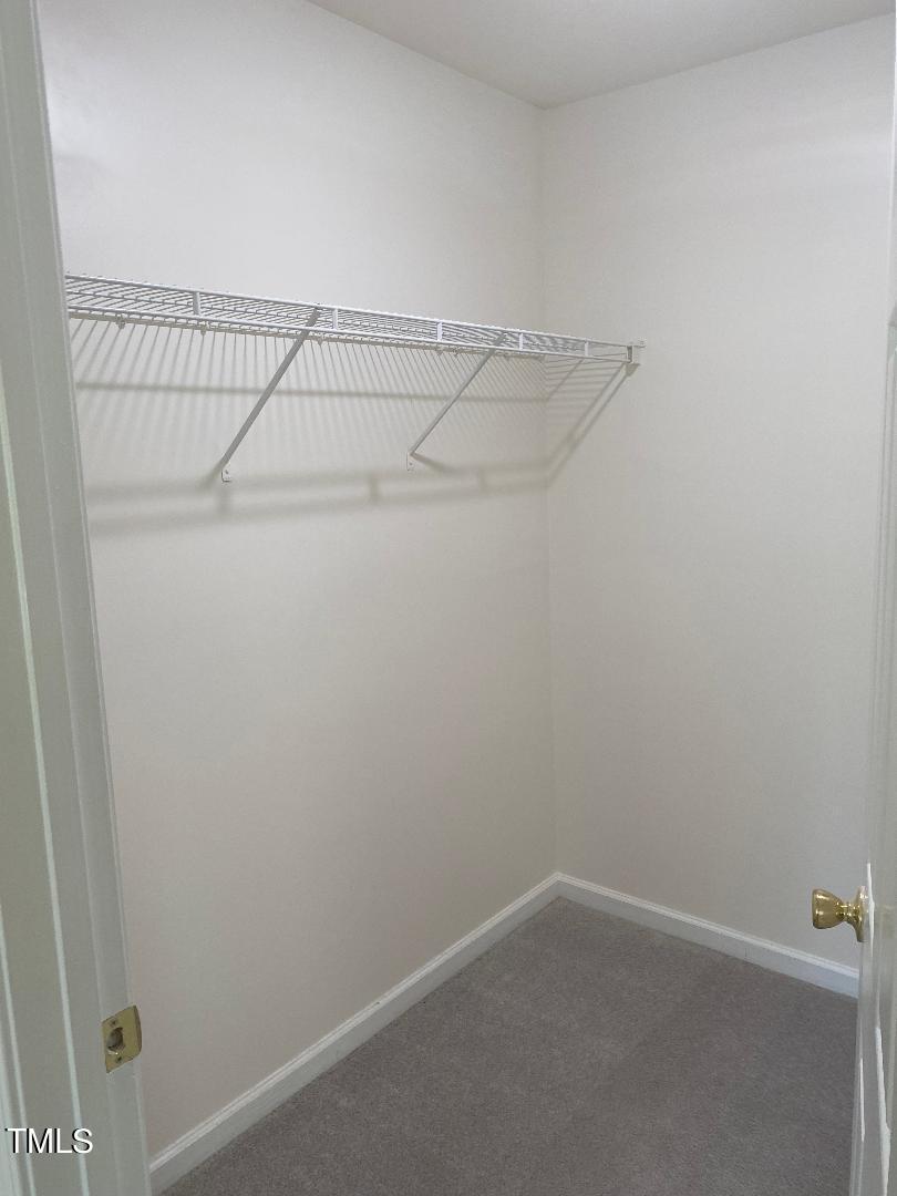 8630 Neuse Landing Lane, Unit 107 Raleigh, NC 27616 - Photo 15 of 26 8630NeuseLandingMbedroomWIC
