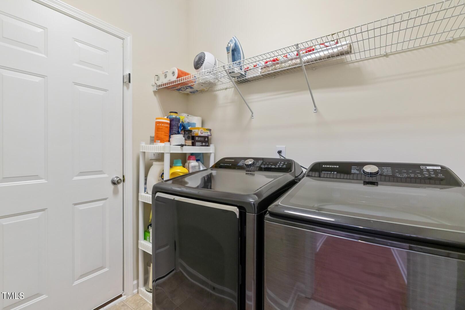12219 Fox Valley Street Raleigh, NC 27614 - Photo 20 of 36 a utility room with dryer and washer