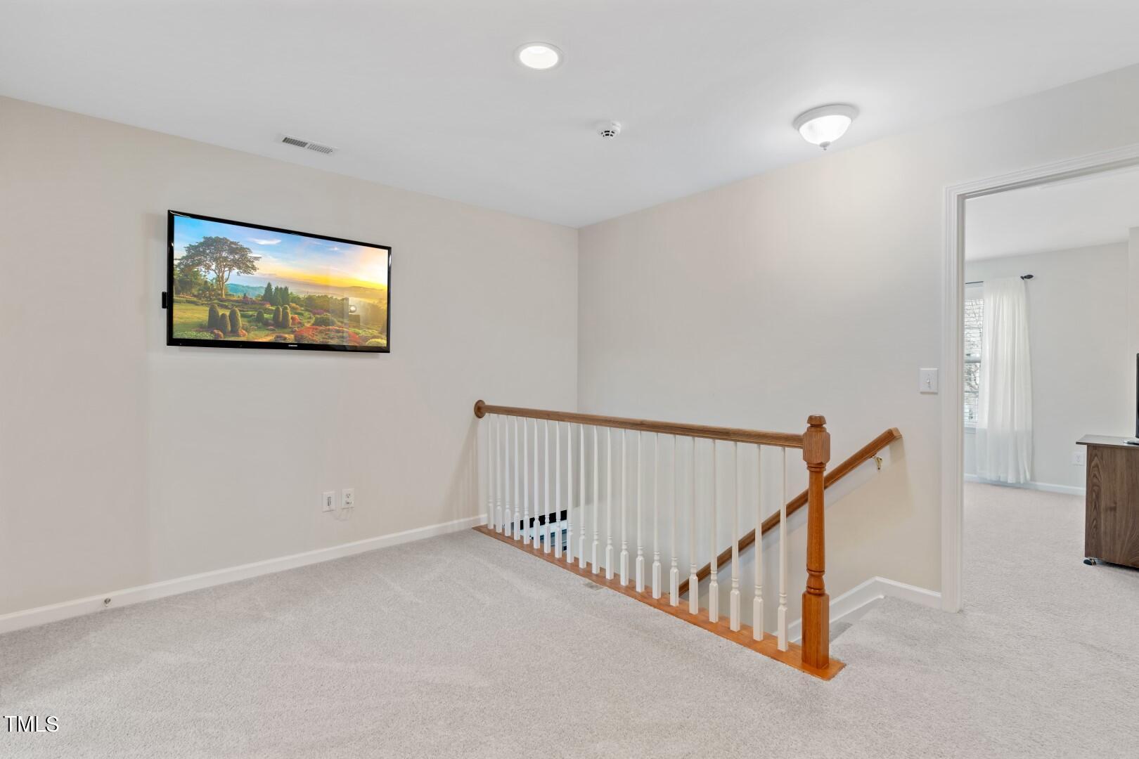 12219 Fox Valley Street Raleigh, NC 27614 - Photo 21 of 36 a view of staircase with white walls