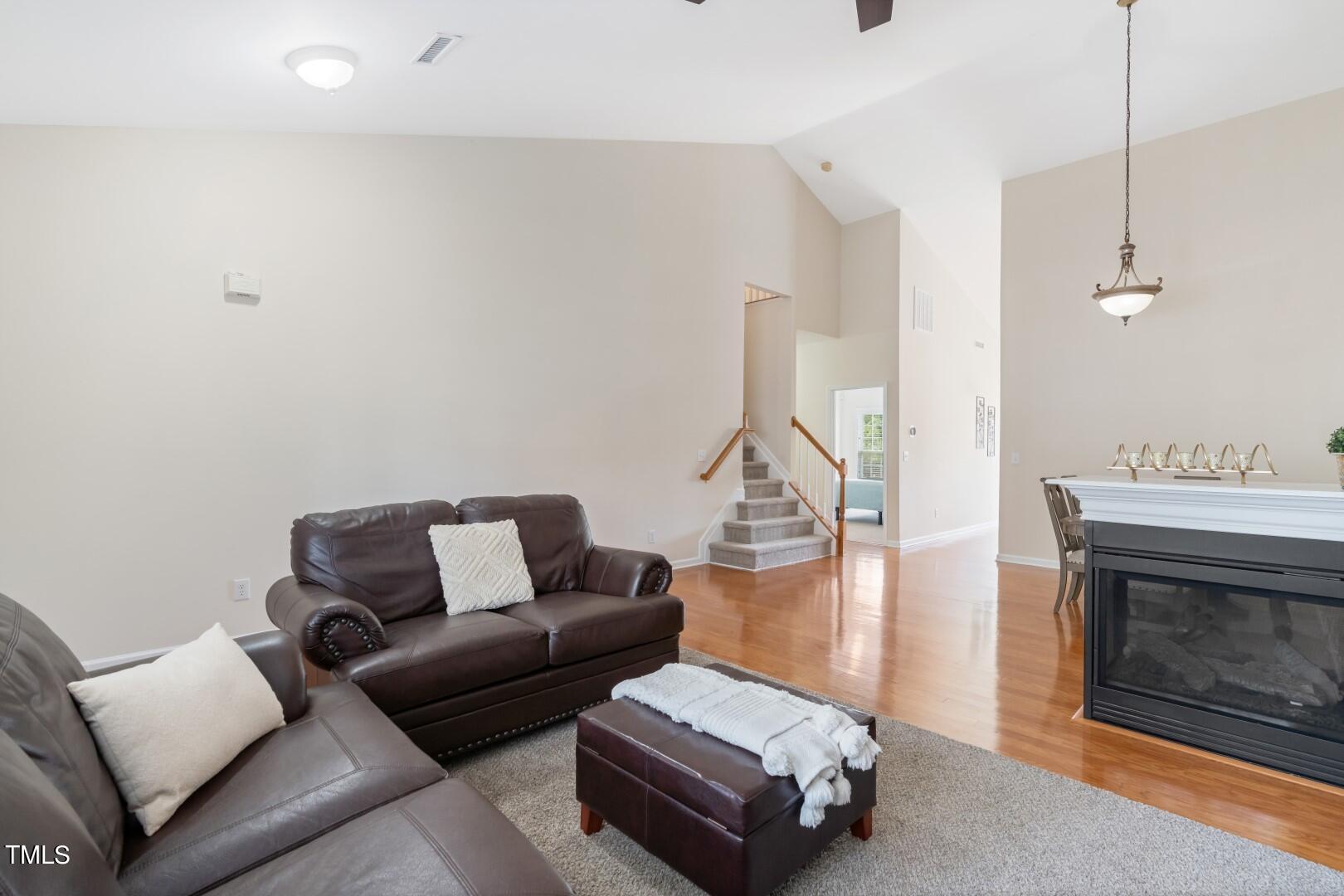 12219 Fox Valley Street Raleigh, NC 27614 - Photo 7 of 36 a living room with furniture and a fireplace