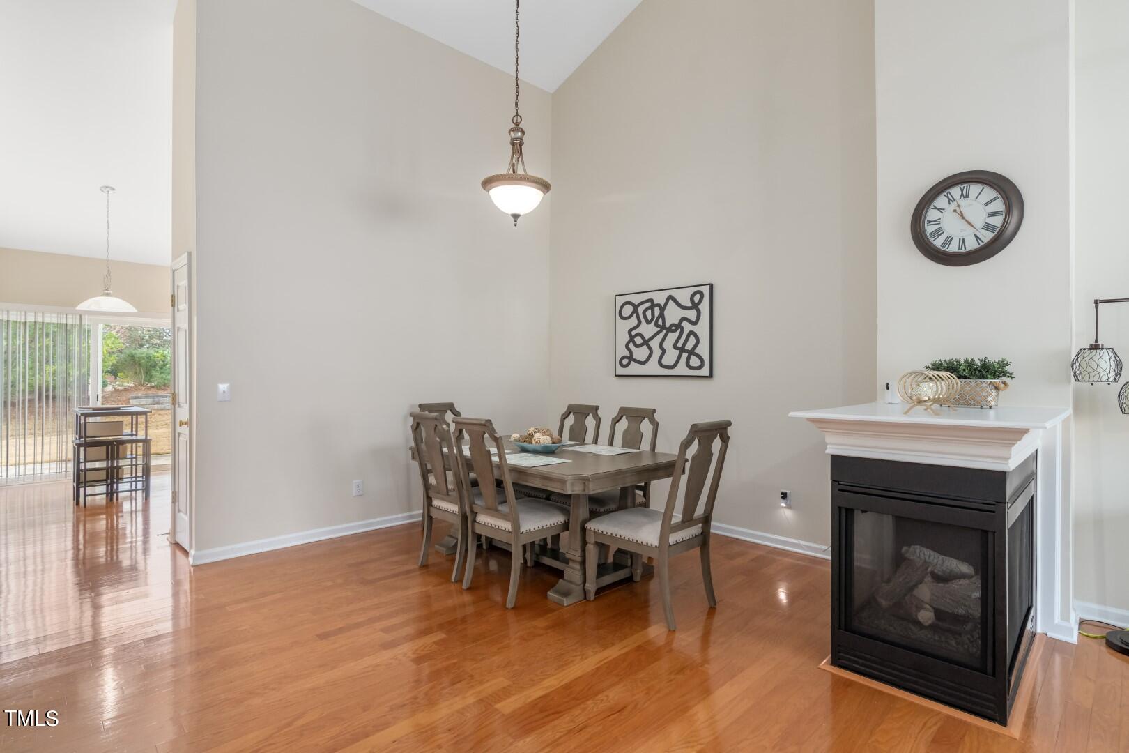 12219 Fox Valley Street Raleigh, NC 27614 - Photo 10 of 36 a dining room with furniture and wooden floor