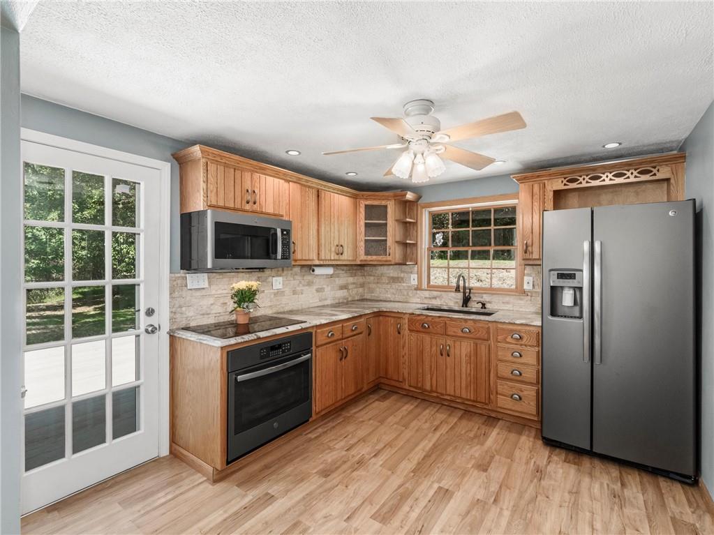 112 Bellbridge Road Elizabeth, PA 15037 - Photo 10 of 25 Kitchen opens to the amazing side yard deck