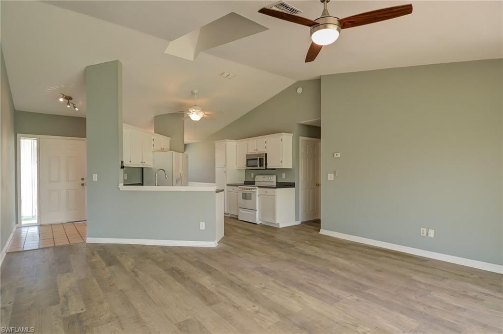 17437 Lee Road Fort Myers, FL 33967 - Photo 3 of 23 a view of a kitchen with microwave and cabinets