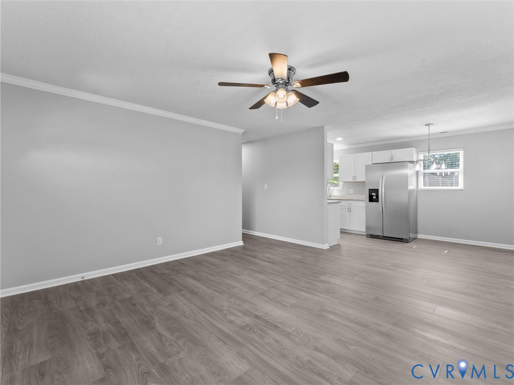 6927 Carsley Road Waverly, VA 23890 - Photo 9 of 51 Wood-finish flooring throughout, crown molding, an