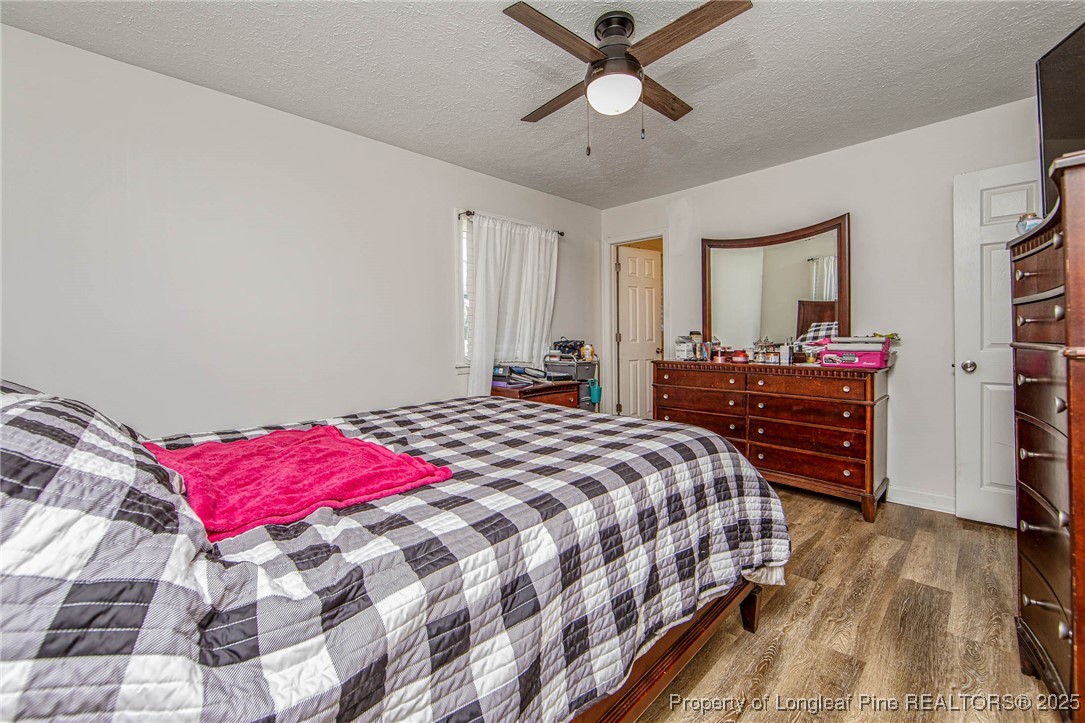 40 Kinlaw Road Lumberton, NC 28358 - Photo 50 of 50 a bedroom with a bed and wooden floor