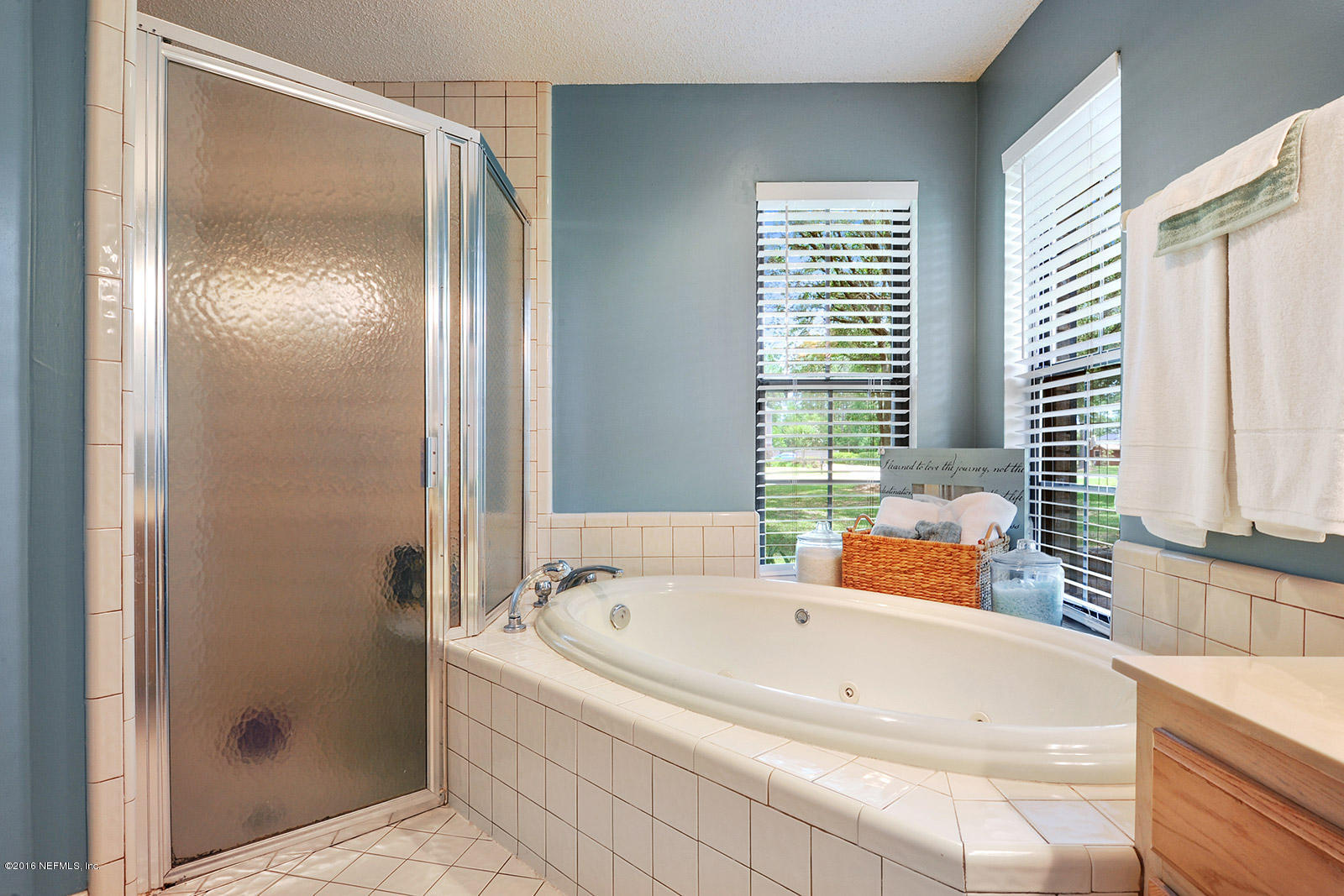55481 Deer Run Road Callahan, FL 32011 - Photo 12 of 26 a bathroom with a bathtub and a shower