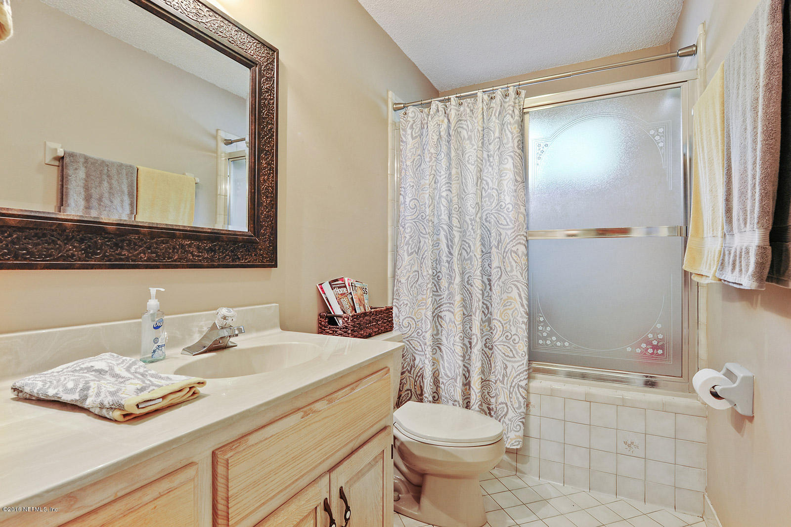 55481 Deer Run Road Callahan, FL 32011 - Photo 14 of 26 a bathroom with a sink a toilet and shower