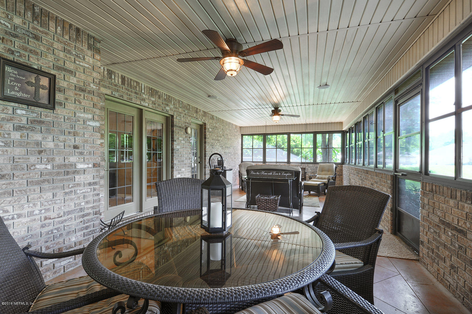 55481 Deer Run Road Callahan, FL 32011 - Photo 17 of 26 a dining room with furniture a chandelier and wooden floor