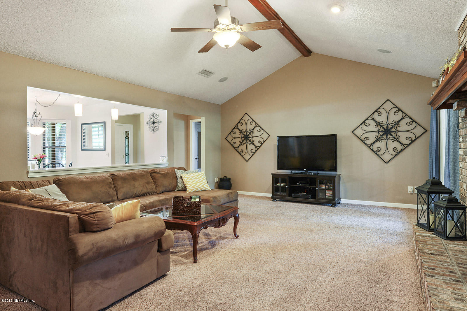 55481 Deer Run Road Callahan, FL 32011 - Photo 3 of 26 a living room with furniture a flat screen tv and a large window