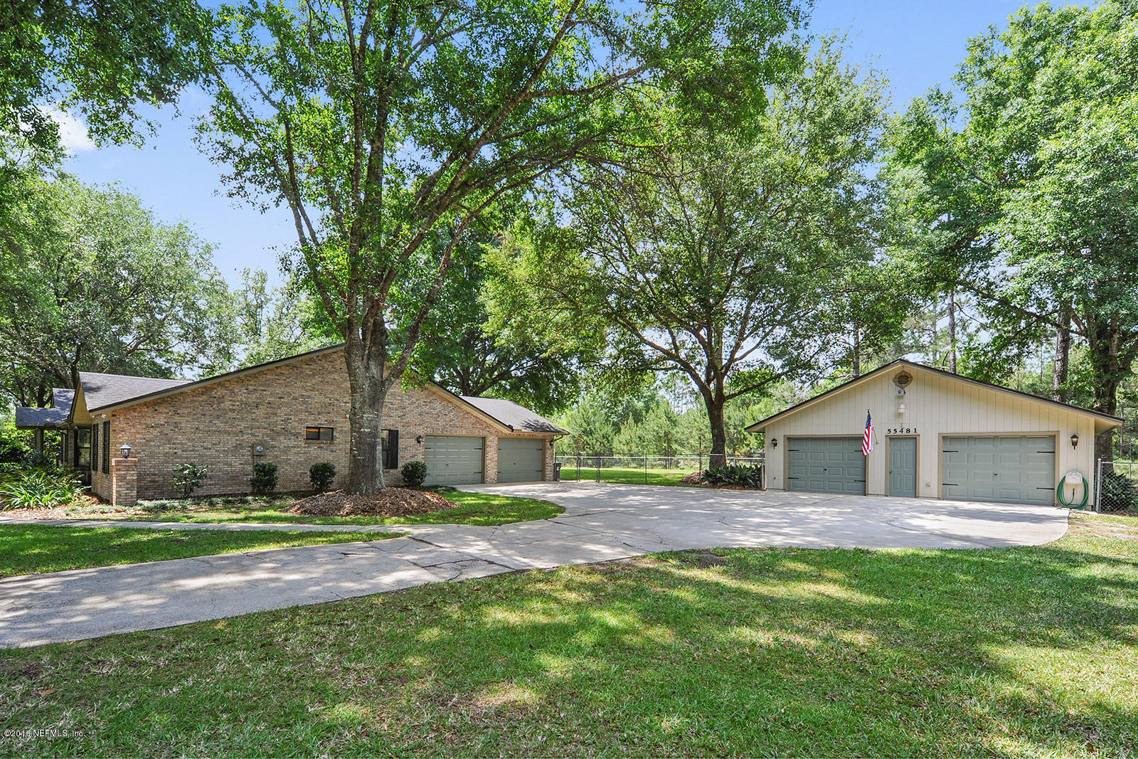 55481 Deer Run Road Callahan, FL 32011 - Photo 25 of 26 a house with green field in front of it