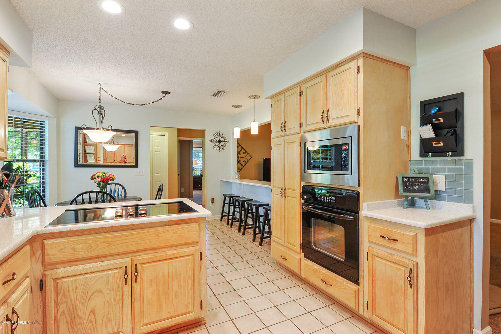 55481 Deer Run Road Callahan, FL 32011 - Photo 4 of 26 a kitchen with stainless steel appliances granite countertop a sink and cabinets