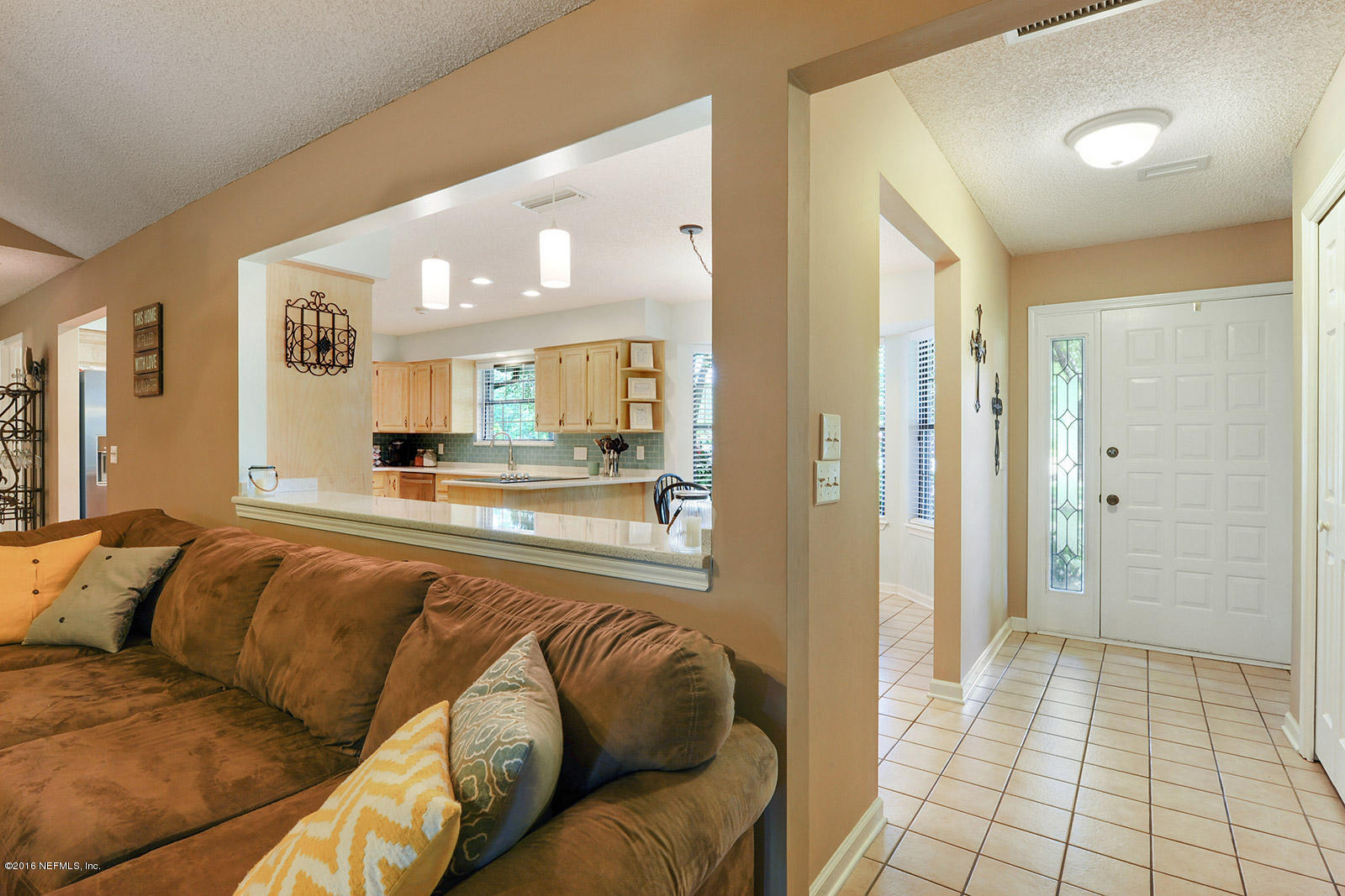 55481 Deer Run Road Callahan, FL 32011 - Photo 7 of 26 a living room with a couch and a view of bathroom