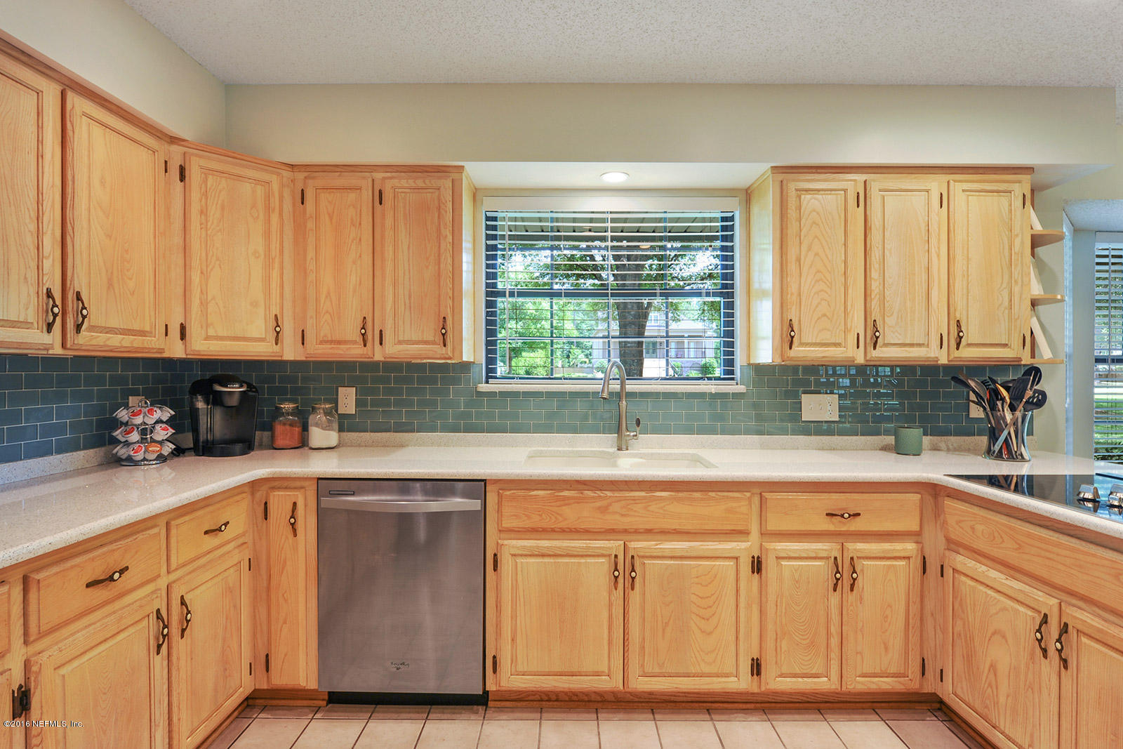 55481 Deer Run Road Callahan, FL 32011 - Photo 8 of 26 a kitchen with stainless steel appliances granite countertop a sink and a white cabinets
