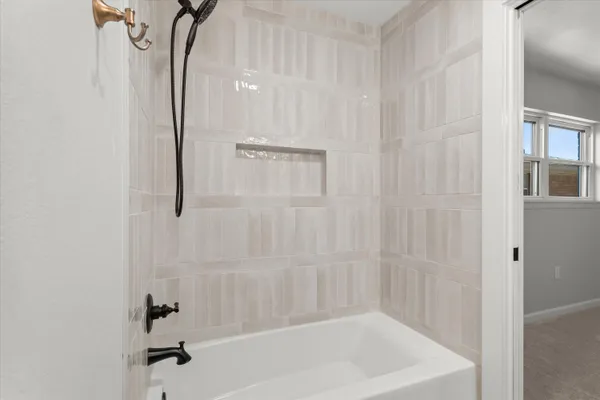 a bathroom with a shower and a bathtub