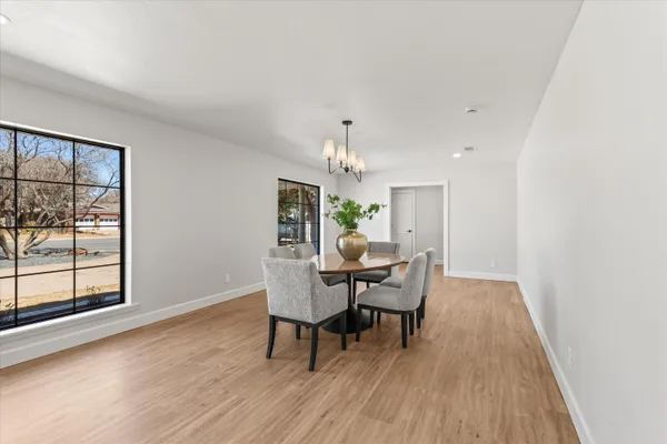 a dining room with furniture and window