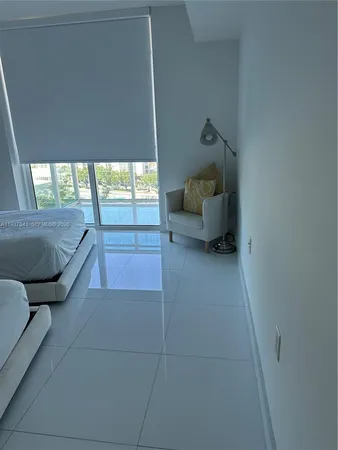 a living room with furniture and a gate