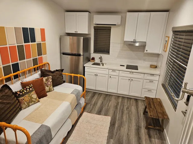 a kitchen with a sink appliances and cabinets