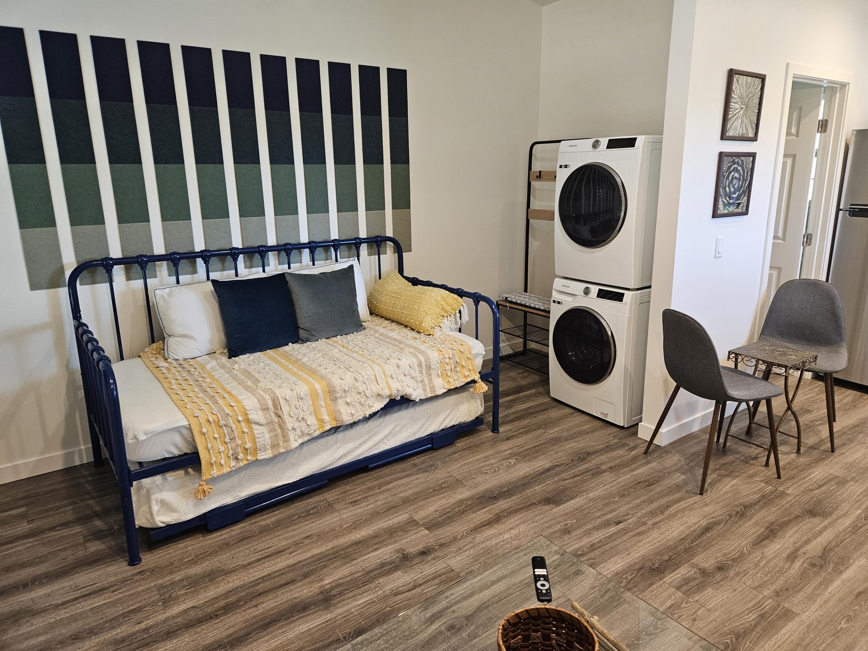 4884 Avenida Del Sol Joshua Tree, CA 92252 - Photo 11 of 18 a bedroom with a bed and cabinets