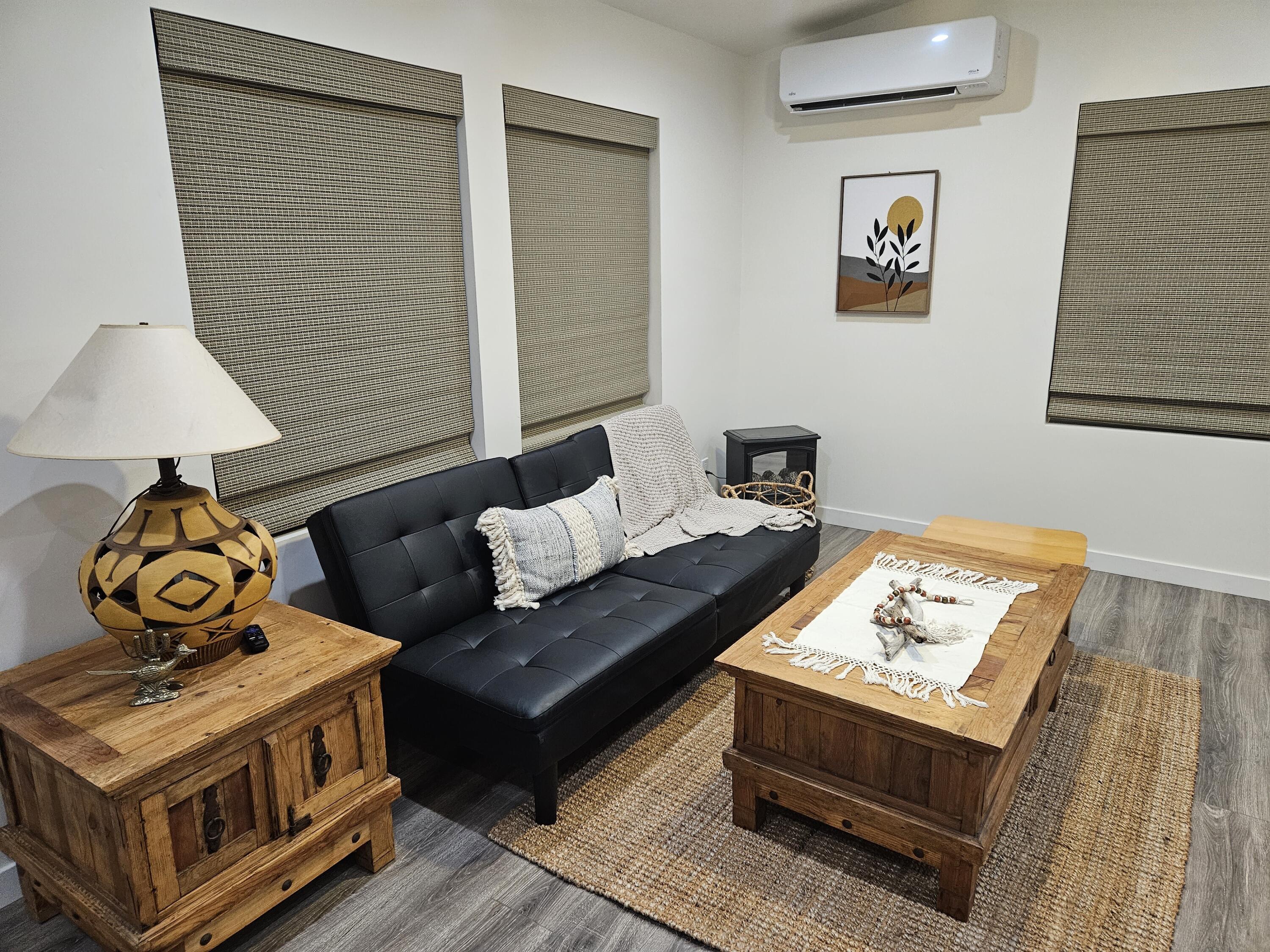 4884 Avenida Del Sol Joshua Tree, CA 92252 - Photo 18 of 18 a living room with furniture and a table