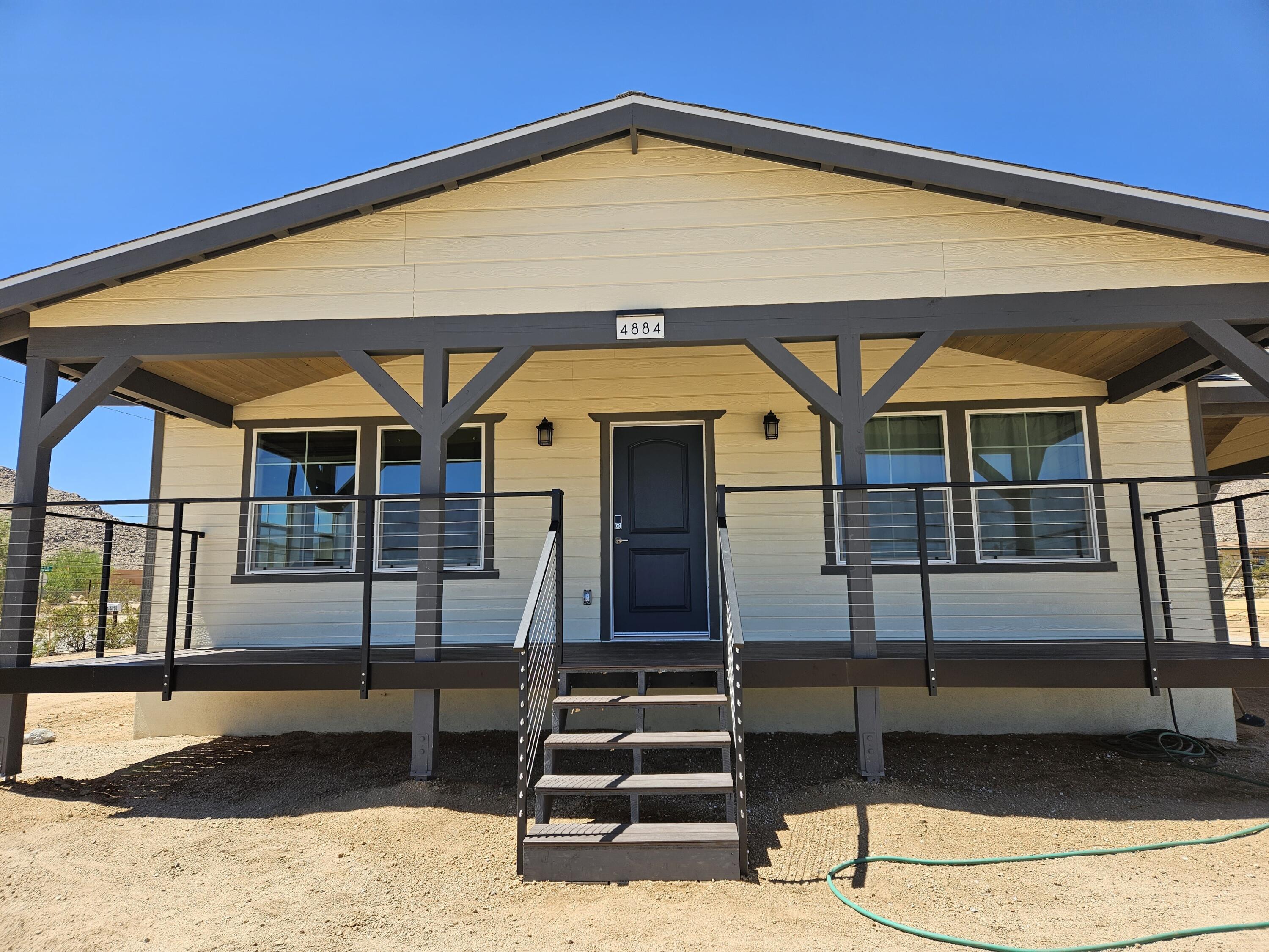4884 Avenida Del Sol Joshua Tree, CA 92252 - Photo 2 of 18 a view of a back yard