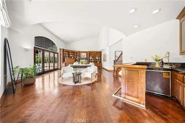 a view of a backyard with plants and palm tree
