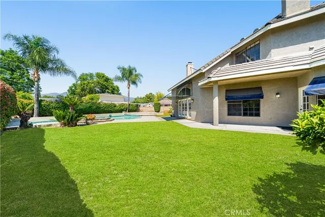 a view of a livingroom with furniture and a window