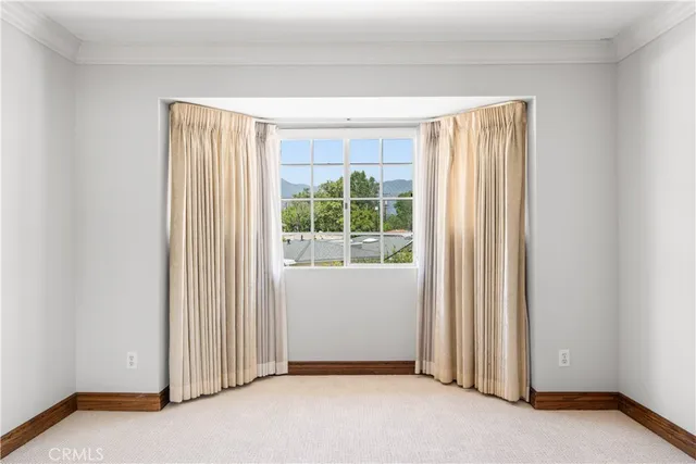 a spacious bathroom with a tub sink and mirror
