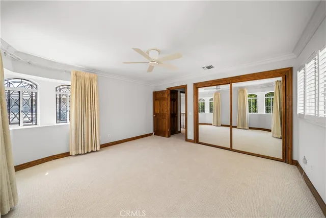 an aerial view of a house with a yard and furniture