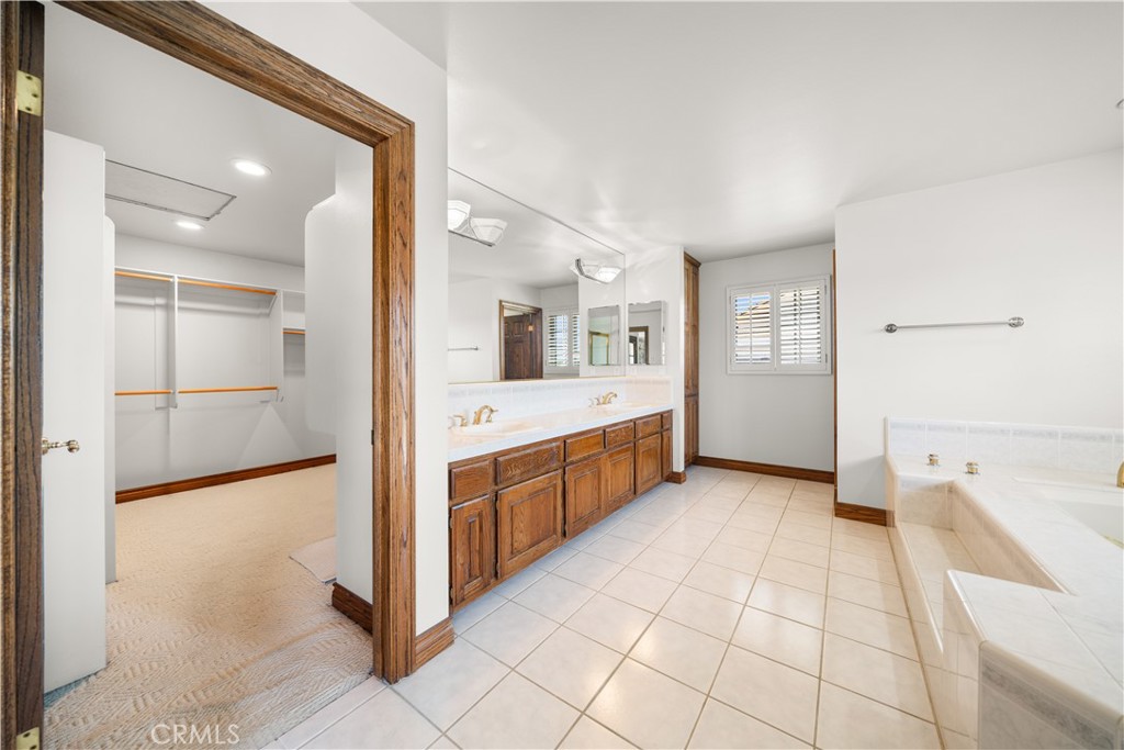 519 Connie Rae Way Arcadia, CA 91006 - Photo 57 of 71 a large white room with a large mirror and double vanity