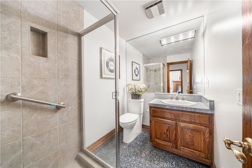 519 Connie Rae Way Arcadia, CA 91006 - Photo 10 of 71 a bathroom with a granite countertop toilet a sink and a mirror