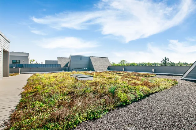 a view of swimming pool with outdoor seating and plants