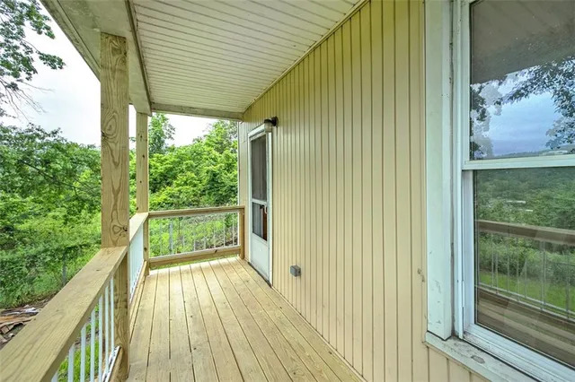a view of a yard with a tree
